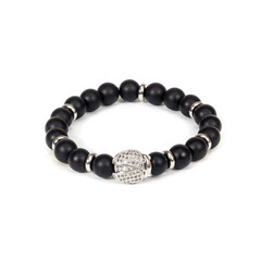 Obraz premium High-quality studio shot of a bold black stone wrist accessory for men. Representing strength, modern style, and professional craftsmanship for masculine fashion and retail.