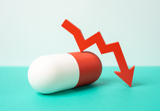 Medicinal capsule and red arrow pointing down. Decreasing drug effectiveness and limited popularity. Antibiotics shortage and supply decline. Pharmaceutical market crisis and resistance problem