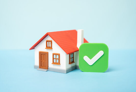 Home and green check mark of approval. Real estate verification and legal compliance. Secure purchase or sale transaction. Property inspection and trusted housing deal