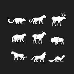 Fototapeta premium Set of Wild Animal Silhouettes Vector Icons on Dark Background