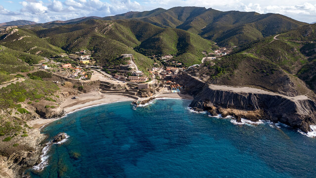 Aerial view of Argentiera Beach and historic mining village, Sardinia
