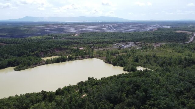 A hole filled with water like a lake due to coal mining in Kalimantan