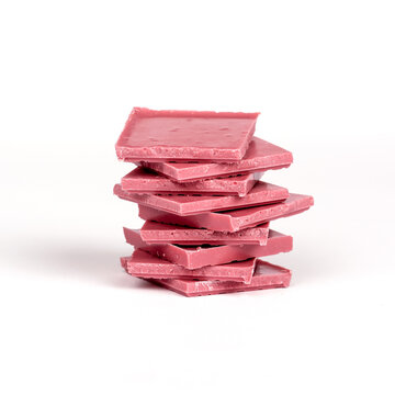Stack of pink chocolate bars isolated on white background