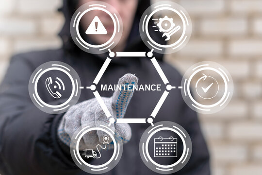 Worker using using virtual touch screen presses the text MAINTENANCE. Industry, Maintenance, Engineering and Construction concept. Preventive maintenance.