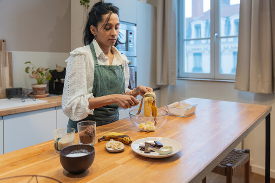Indian Woman Preparing Bananas For Baking