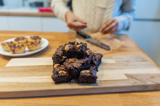 Freshly Baked Brownies On Wooden Cutting Board

