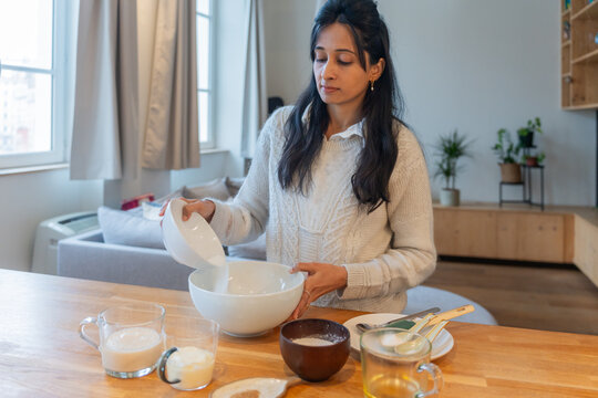 Indian Woman Preparing Baking Ingredients

