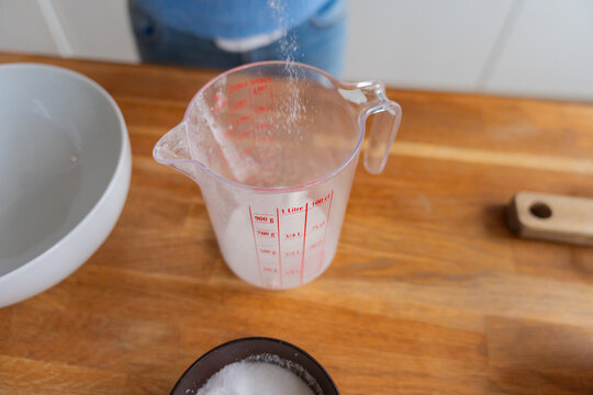 Pouring Ingredient Into Measuring Jug

