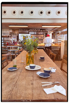 Bright and inviting wooden table of a cafe after a meal.