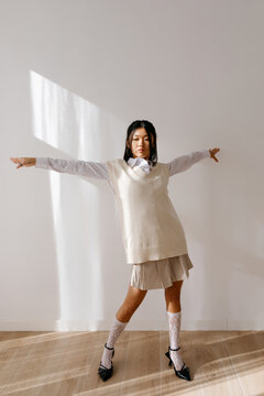 Fashion model dancing in natural light