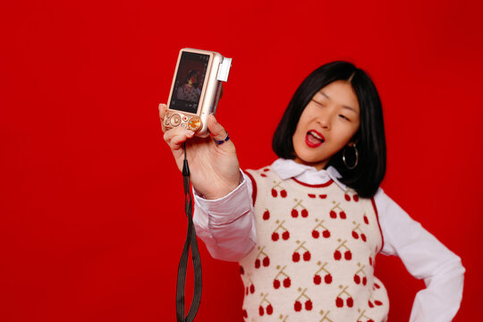 Woman taking shot with digicam