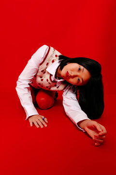 Woman in trendy clothes on red background