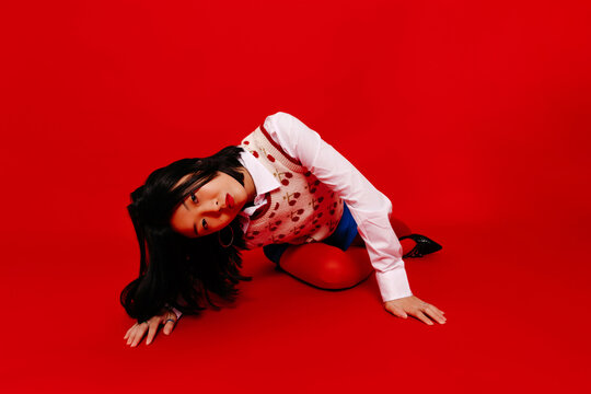 Young dancer lying on floor in studio