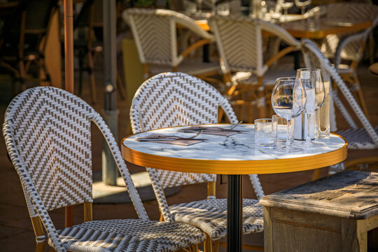 Al fresco tables waiting for customers at an outdoor restaurant in the Haut de Cagnes hilltop village of Cagnes sur Mer, South of France