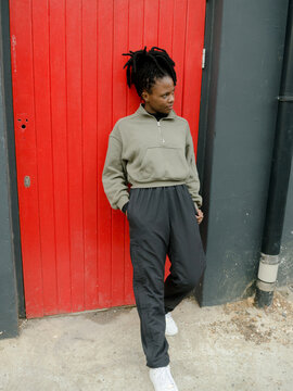 Young African woman with dreads in winter clothing