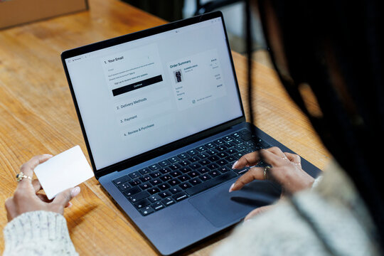 Anonymous Woman hands on checkout page of online shopping web