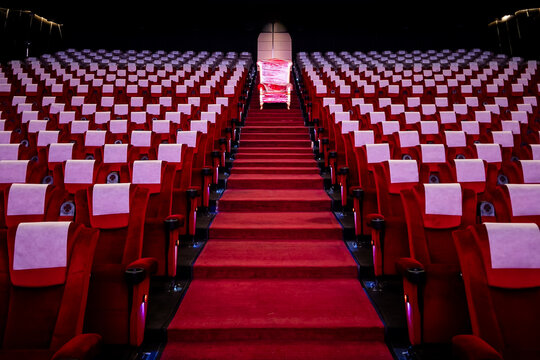A plastic-wrapped throne in the middle of an empty cinema