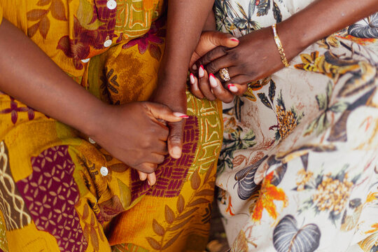 Mother and daughter holding hands