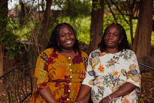 Mother and daughter seated in a park