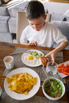 Family eating lunch together at dining table
