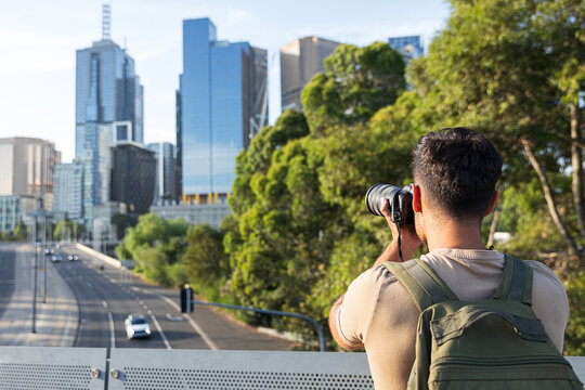 Man capturing photos of Melbourne Australia and traffic view