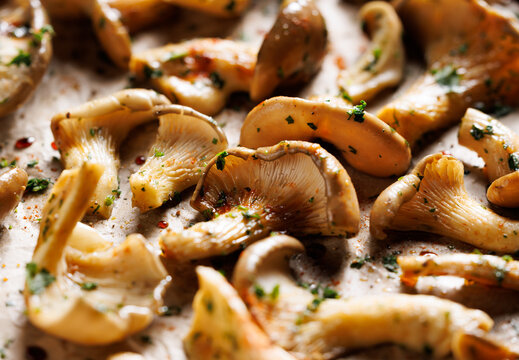 Fresh oyster mushrooms in a herbal marinade ready to be baked, focus of the mushroom inside