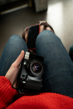 Woman photographer holding vintage film camera