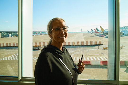  Woman at Airport Terminal Window