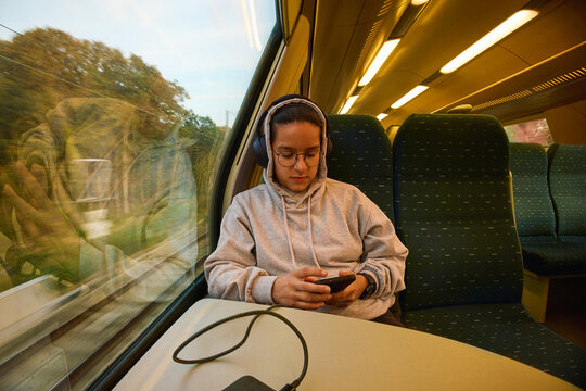 Person Reading on Train Ride