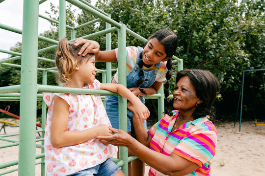 Grandmother and Granddaughters at the Playground