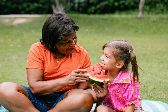 Grandmother and Granddaughter Sharing Watermelon