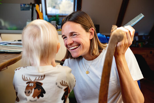 Mother laughing at her child