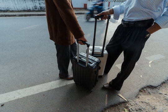 Travellers Waiting with Luggage