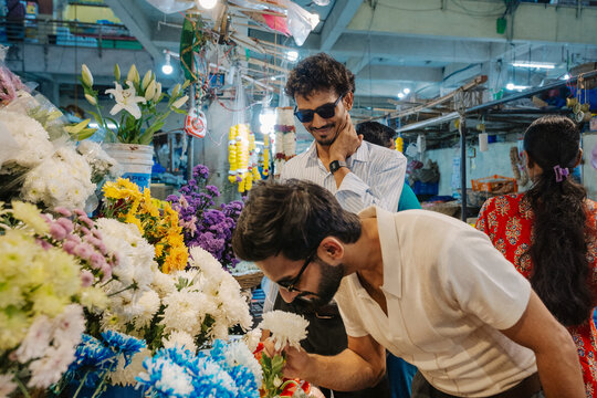 Friends Exploring a Bustling Flower Market