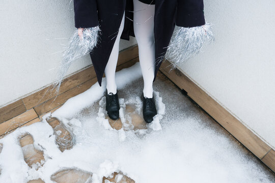 Stylish footwear contrasts with wintery snowy ground