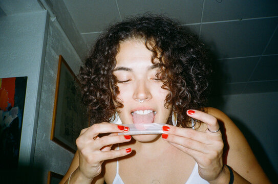 Close-up of curly hair woman rolling up join 