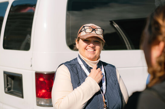 Smiling Woman with Lanyard 