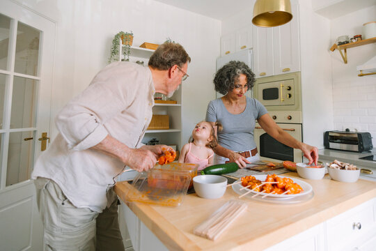 Toddler send kisses to grandfather