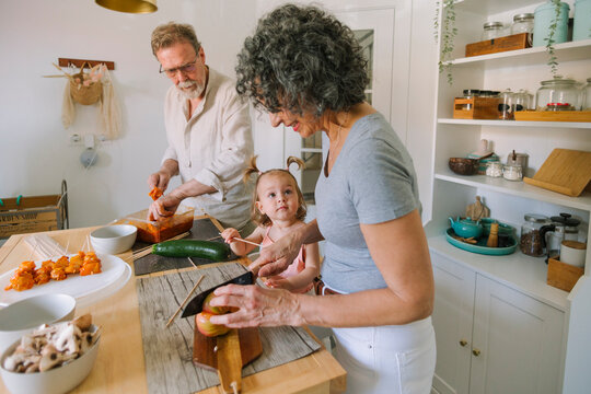  Family Cooking Together in Kitchen