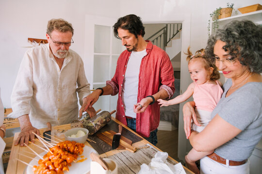 Family Prepares Grilling Ingredients