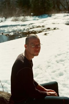 Crew hair cut man with glasses portrait in the snow