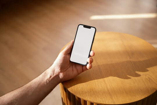 Anonymous using phone with blank screen .