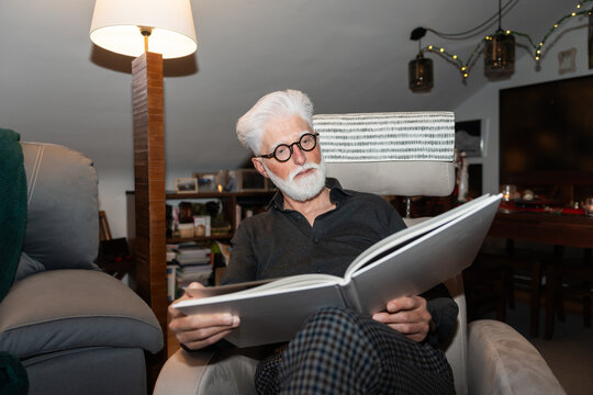 Sophisticated Elderly Man Reading at Home