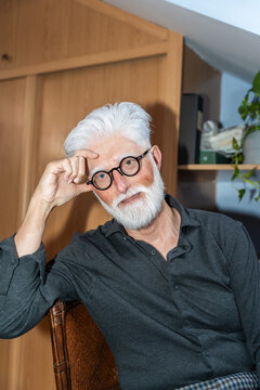 Senior Man With White Beard And Glasses Smiling