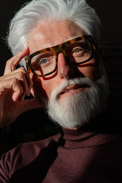 Reflective Senior Man With White Beard