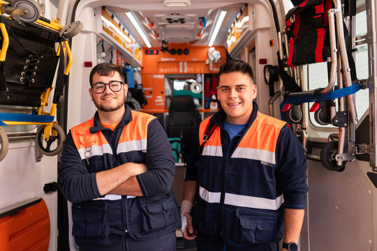 Two paramedics smiling