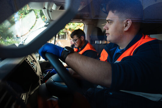Paramedics driving ambulance during emergency service