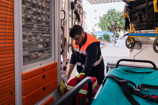 Paramedic preparing medical equipment