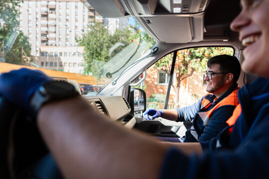 Paramedics driving ambulance during emergency in the city