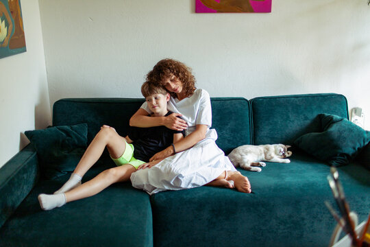  mother with son sitting on the sofa in the room